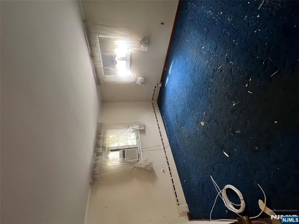 106 Prescott Street Demarest, NJ 07627 - Photo 20 of 24 an empty room with a fireplace and painted walls
