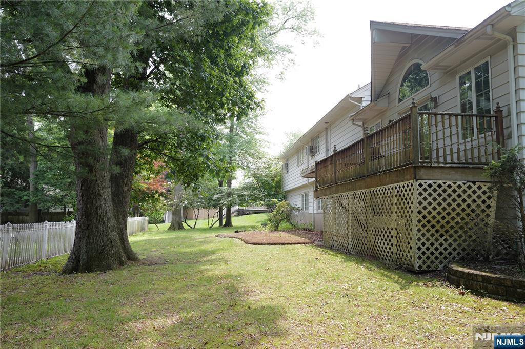 106 Prescott Street Demarest, NJ 07627 - Photo 22 of 24 a view of a yard with a large tree