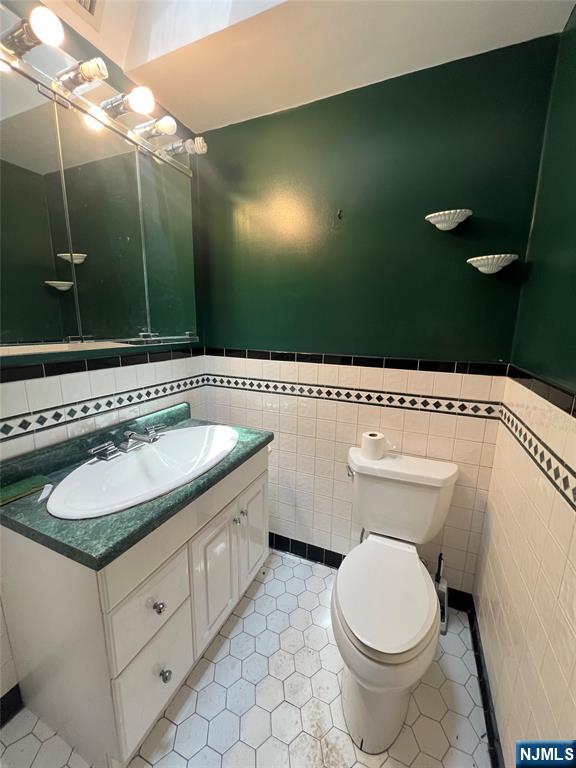106 Prescott Street Demarest, NJ 07627 - Photo 4 of 24 a bathroom with a sink and a mirror