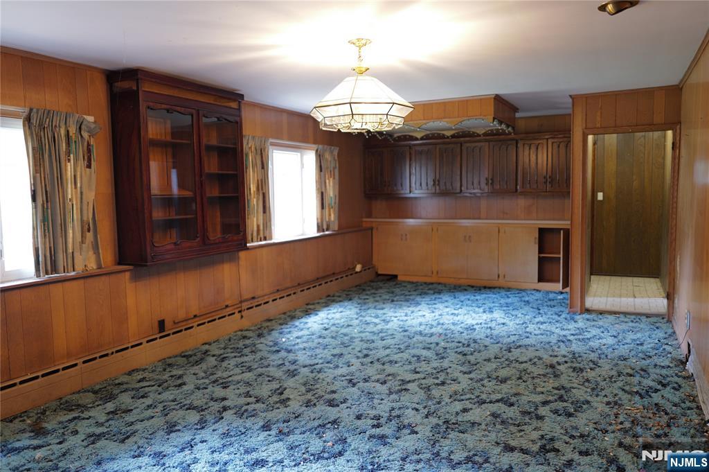 106 Prescott Street Demarest, NJ 07627 - Photo 10 of 24 a view of an empty room with window and hallway