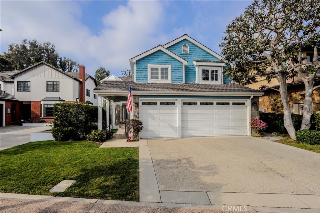 5 Cambridge Manhattan Beach, CA 90266 - Photo 2 of 71 a front view of a house with a yard and garage