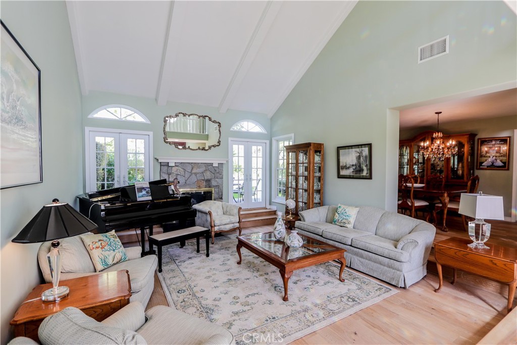 5 Cambridge Manhattan Beach, CA 90266 - Photo 21 of 71 a living room with furniture a rug and a lamp