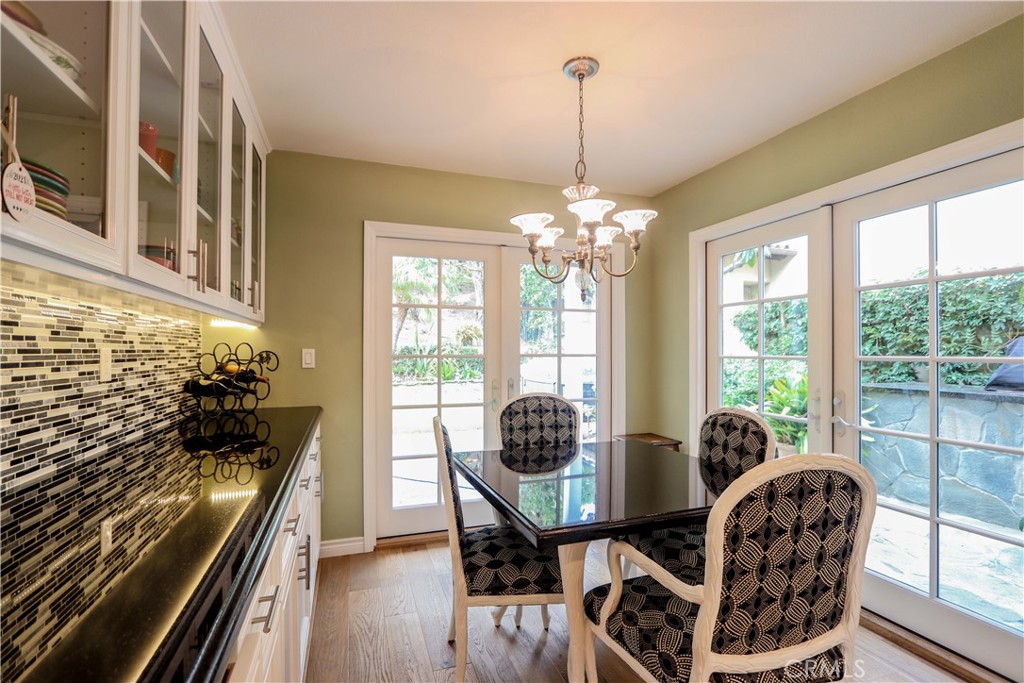 5 Cambridge Manhattan Beach, CA 90266 - Photo 28 of 71 a living room with furniture and a chandelier