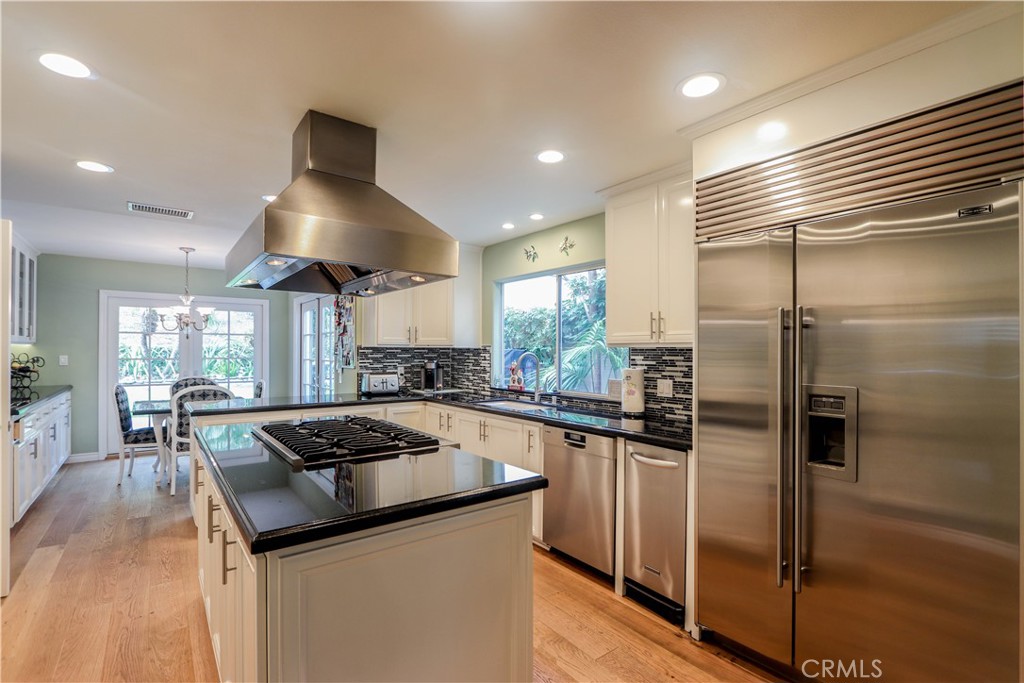 5 Cambridge Manhattan Beach, CA 90266 - Photo 30 of 71 a kitchen with stainless steel appliances granite countertop a sink and a refrigerator