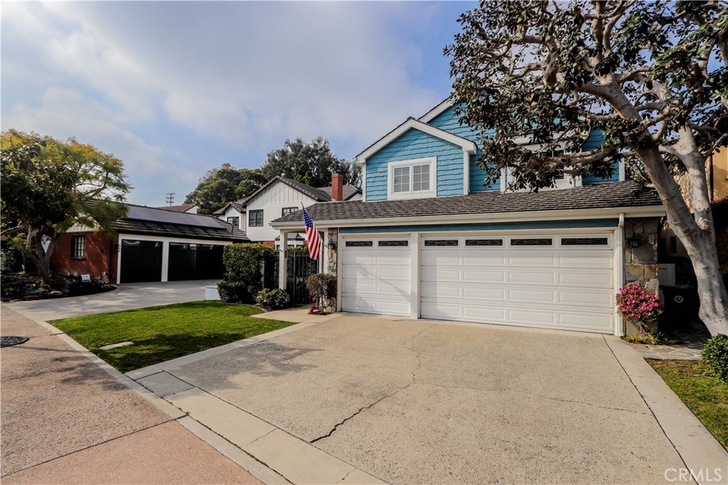 5 Cambridge Manhattan Beach, CA 90266 - Photo 3 of 71 a front view of house with yard and trees in the background