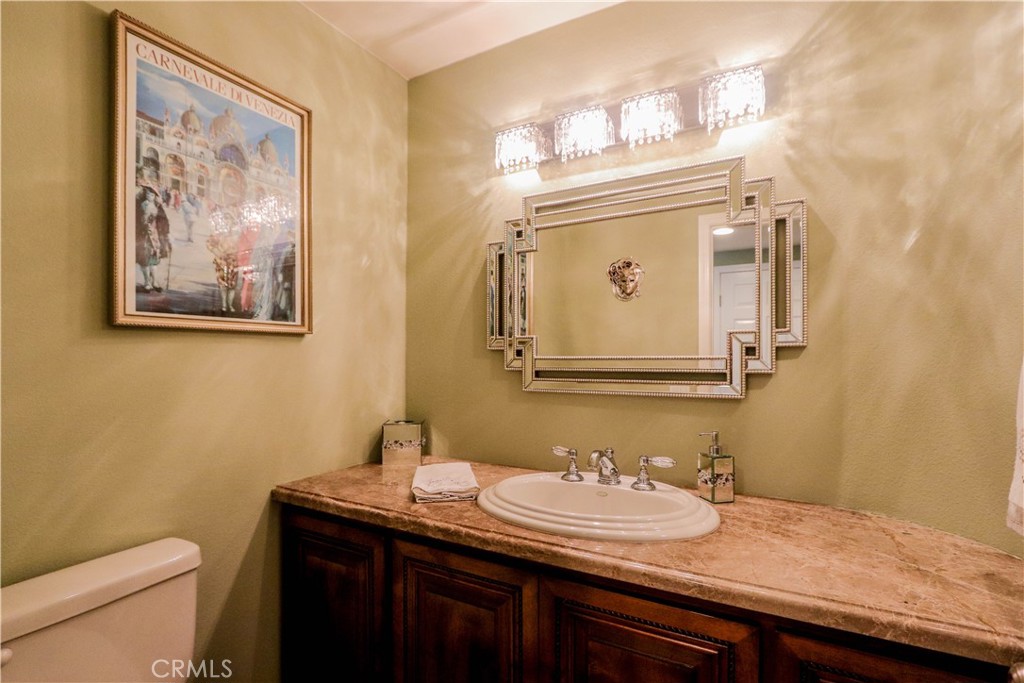 5 Cambridge Manhattan Beach, CA 90266 - Photo 32 of 71 a bathroom with a granite countertop sink and a mirror