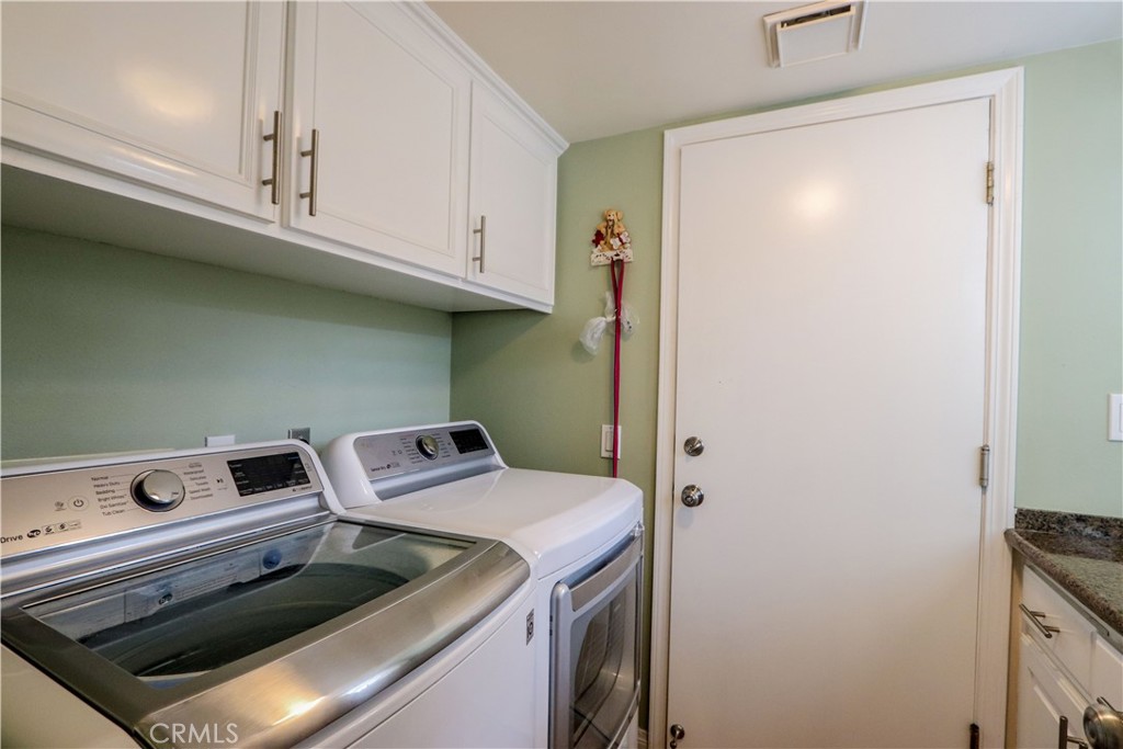 5 Cambridge Manhattan Beach, CA 90266 - Photo 33 of 71 a utility room with dryer and washer