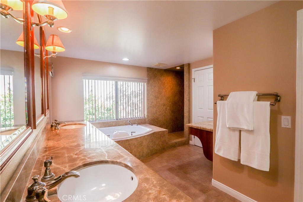 5 Cambridge Manhattan Beach, CA 90266 - Photo 42 of 71 a spacious bathroom with a tub and shower