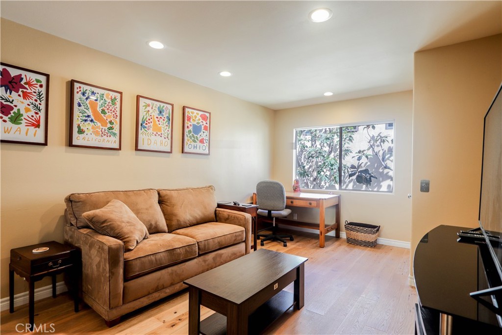 5 Cambridge Manhattan Beach, CA 90266 - Photo 45 of 71 a living room with furniture and a window