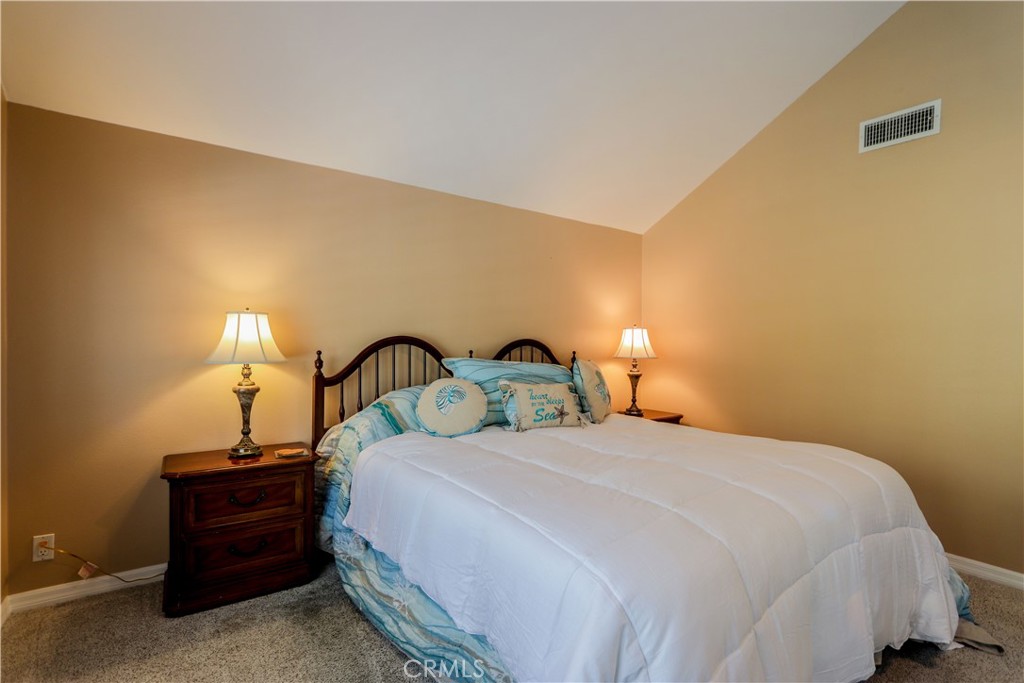 5 Cambridge Manhattan Beach, CA 90266 - Photo 47 of 71 a bedroom with a bed and a lamp
