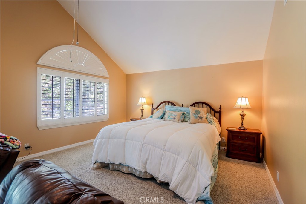 5 Cambridge Manhattan Beach, CA 90266 - Photo 50 of 71 a bedroom with a bed and a window