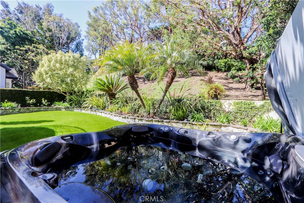 5 Cambridge Manhattan Beach, CA 90266 - Photo 57 of 71 a view of a backyard with a garden and plants