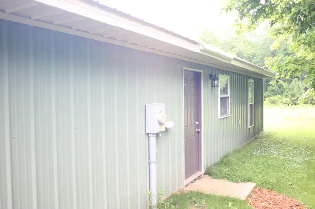 a backyard of a house with wooden fence