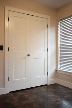 an empty room with wooden floor