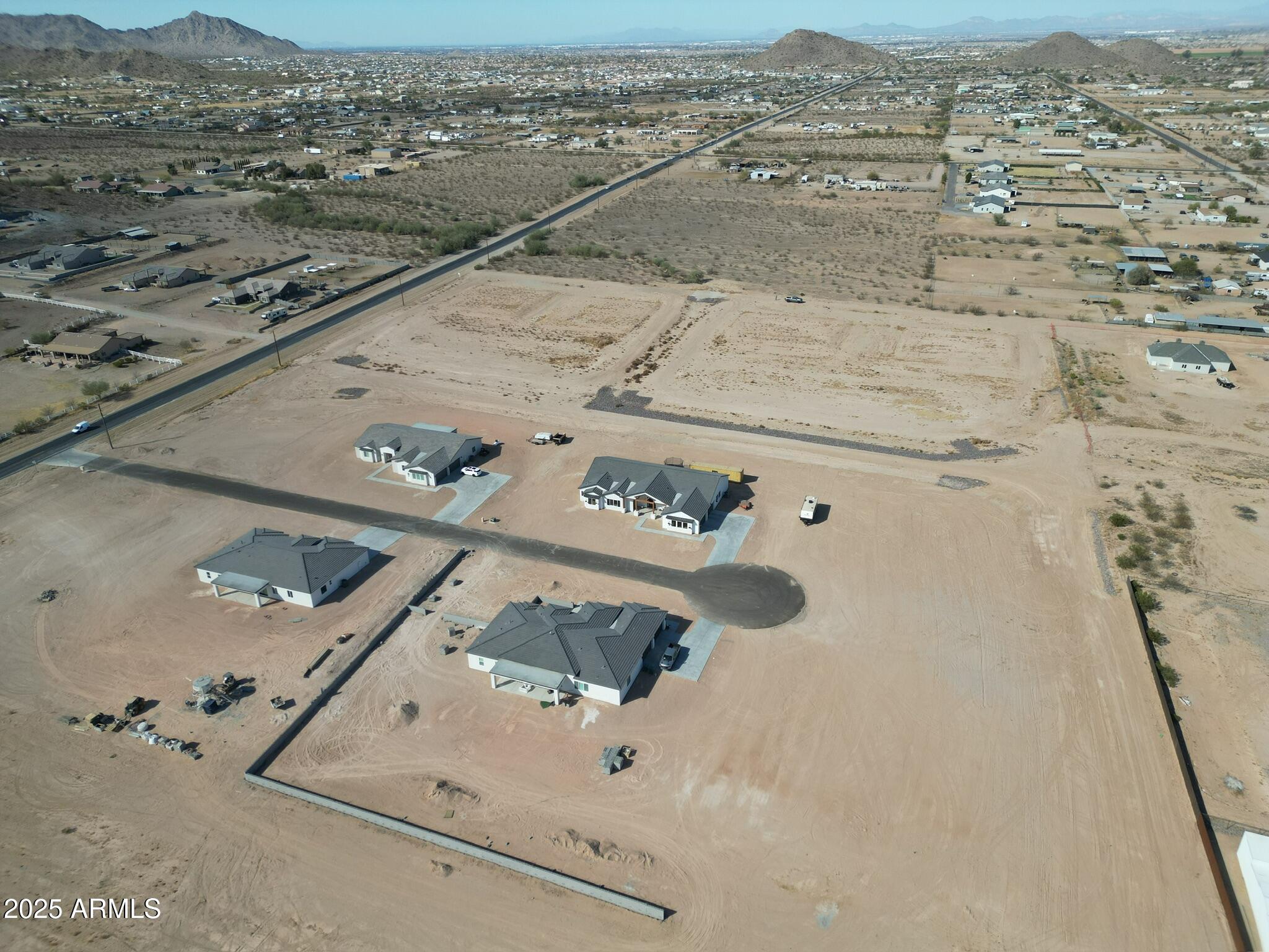 0 West Adobe Dam Road, Unit 3 Queen Creek, AZ 85143 - Photo 13 of 17 an aerial view of residential houses with outdoor space