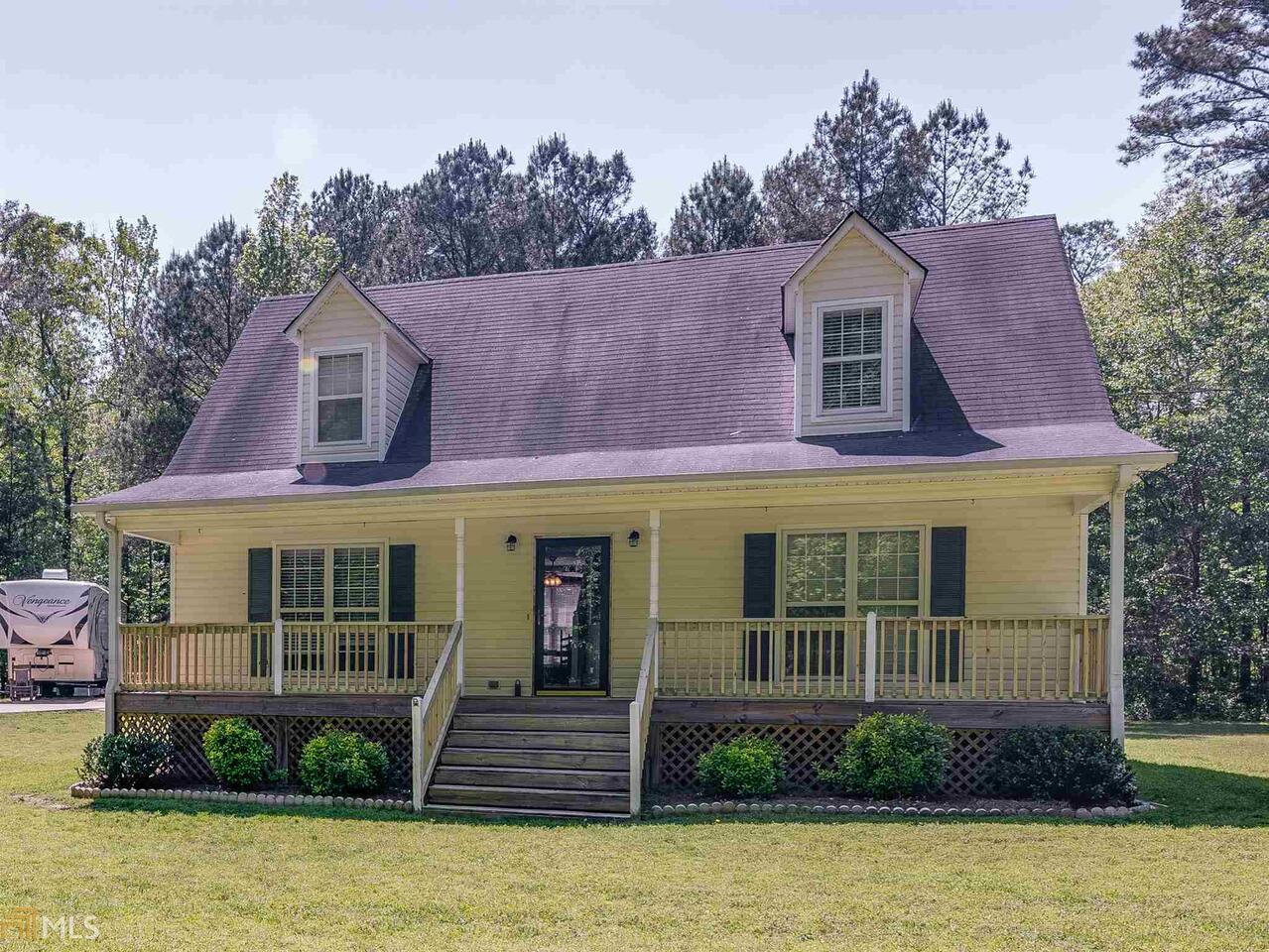 275 Mackey Road McDonough, GA 30252 - Photo 1 of 1 a view of a house with a yard plants and large tree