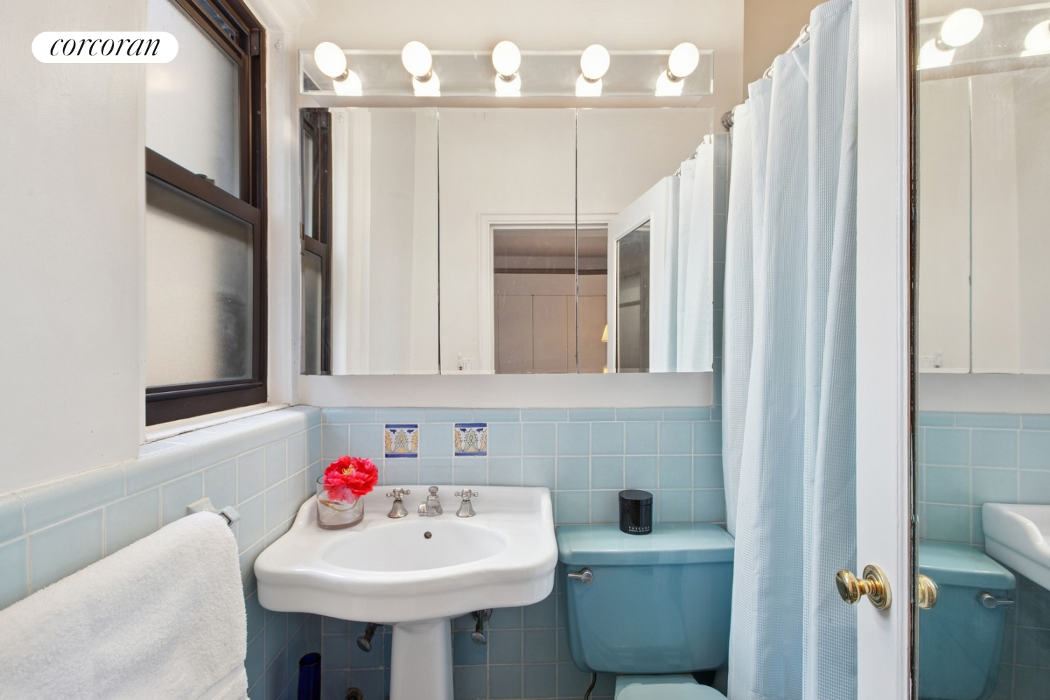 55 East 72nd Street, Unit 11N Manhattan, NY 10021 - Photo 10 of 14 a bathroom with a sink toilet and a mirror
