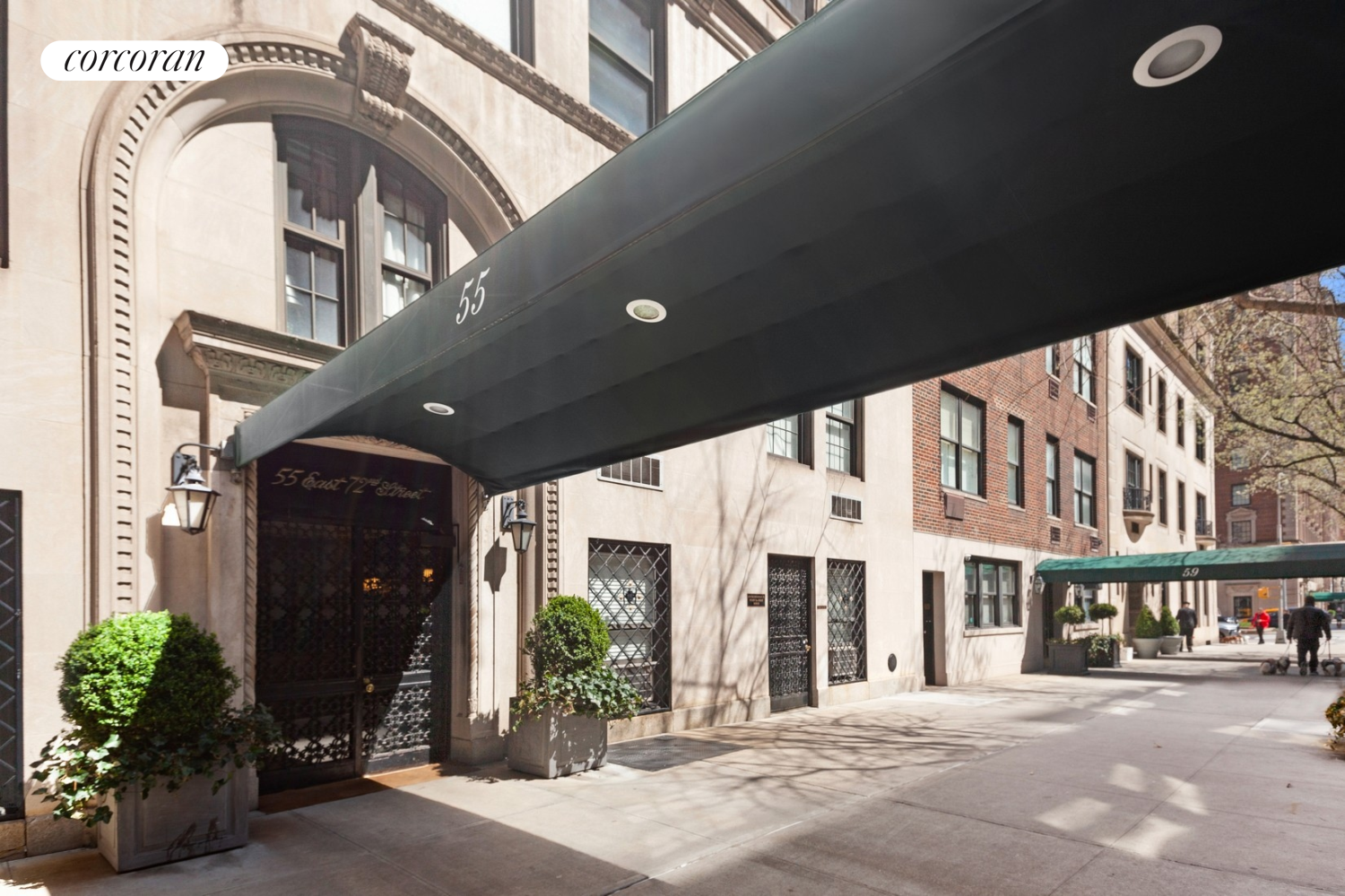 55 East 72nd Street, Unit 11N Manhattan, NY 10021 - Photo 11 of 14 a front view of a building with a garden