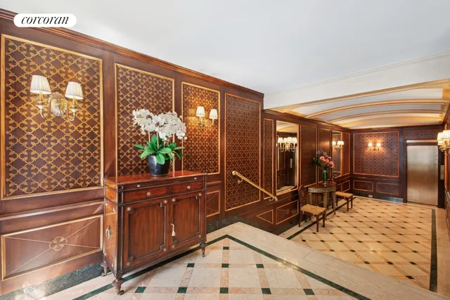 a front view of a building with a garden