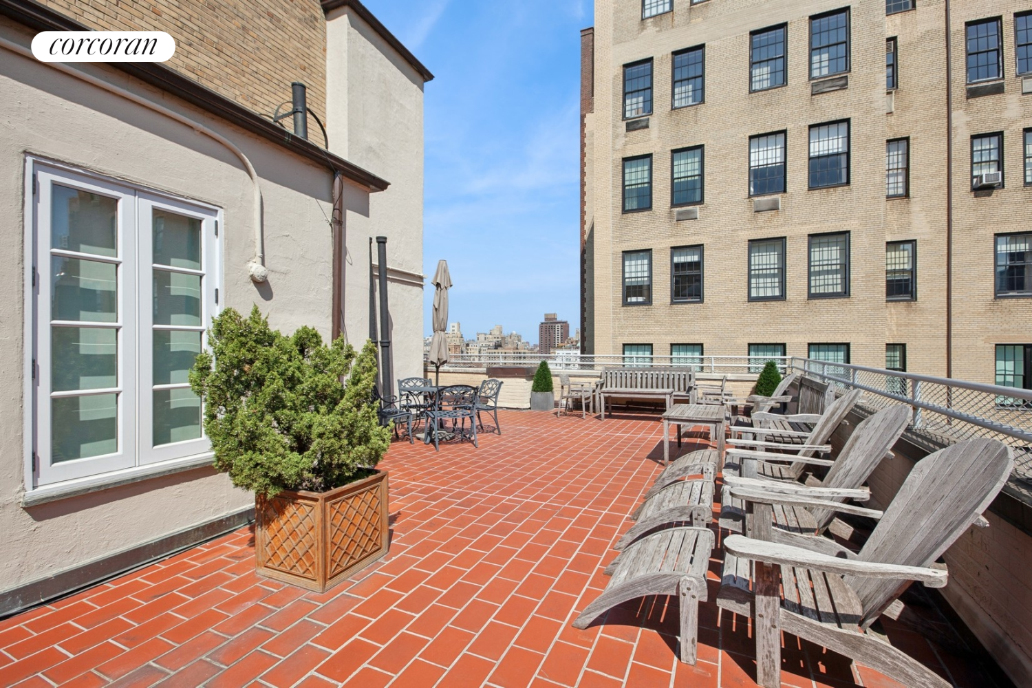 55 East 72nd Street, Unit 11N Manhattan, NY 10021 - Photo 13 of 14 a view of a chairs and table in the patio