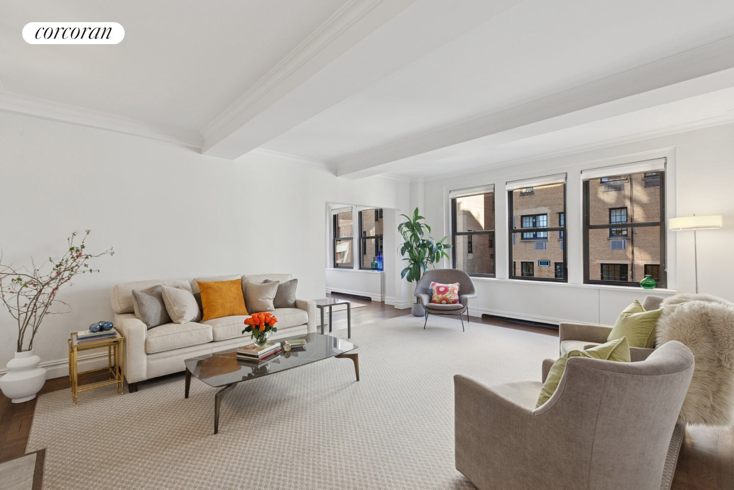 55 East 72nd Street, Unit 11N Manhattan, NY 10021 - Photo 3 of 14 a living room with furniture and floor to ceiling windows