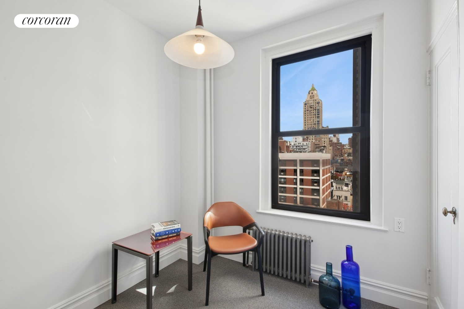 55 East 72nd Street, Unit 11N Manhattan, NY 10021 - Photo 6 of 14 a chair and table in a room