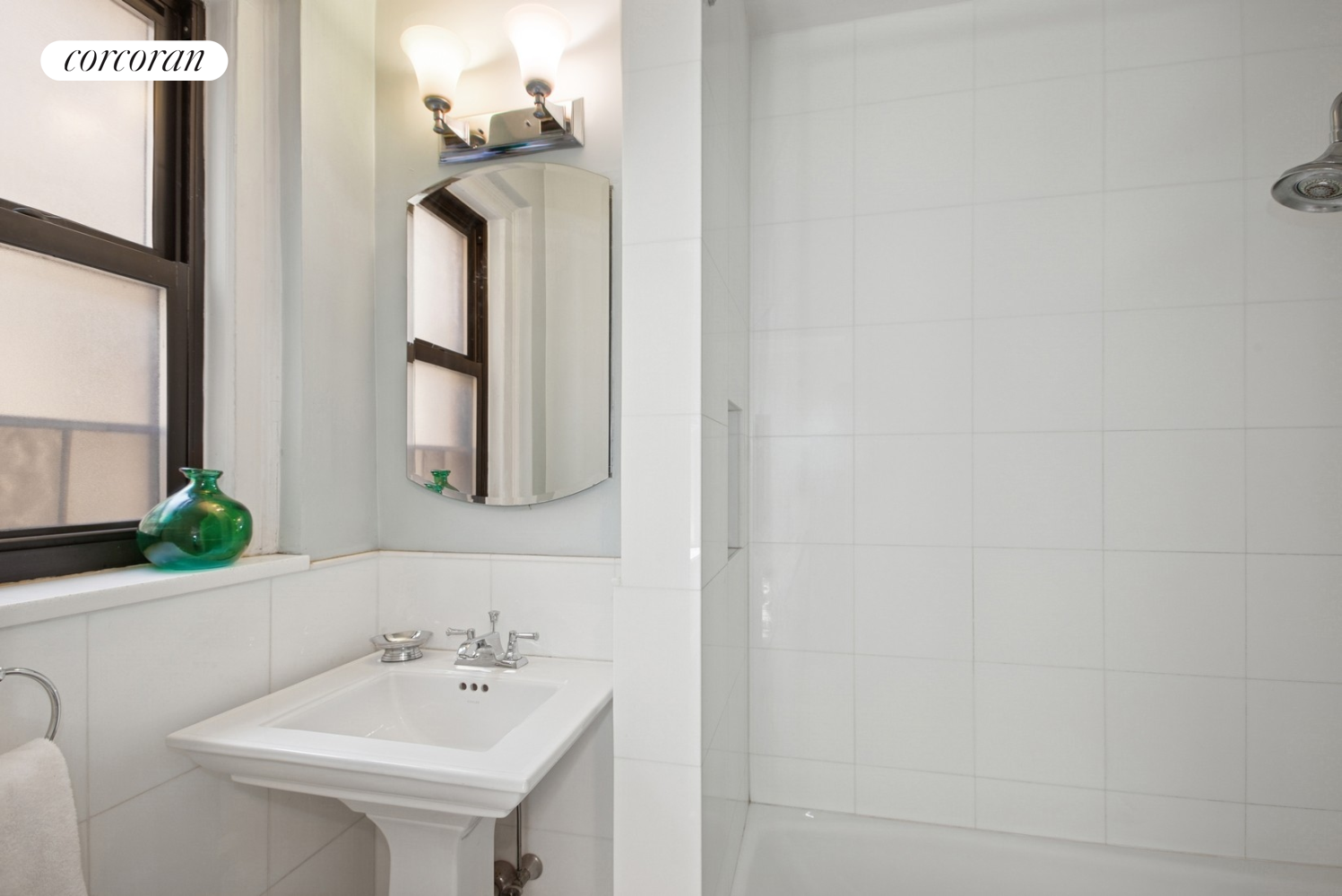 55 East 72nd Street, Unit 11N Manhattan, NY 10021 - Photo 8 of 14 a bathroom with a sink and a mirror