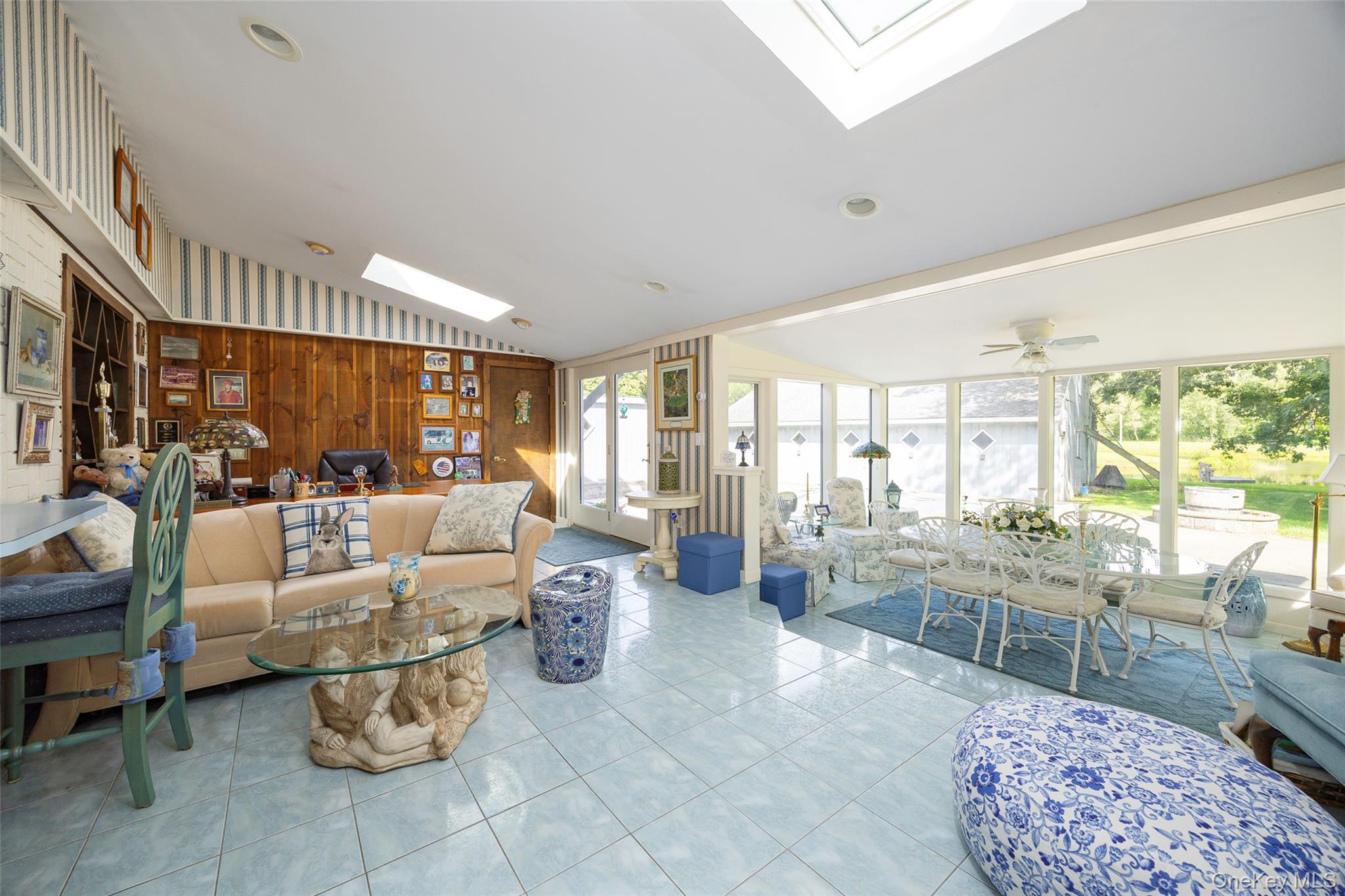89 Deer Pond Road Verbank, NY 12585 - Photo 14 of 40 a living room with furniture large window and wooden floor