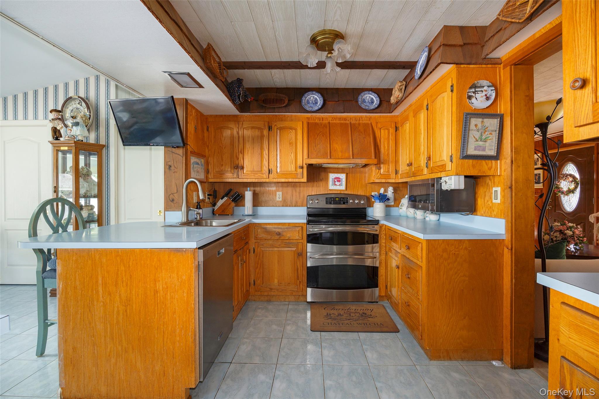 89 Deer Pond Road Verbank, NY 12585 - Photo 16 of 40 a kitchen with stainless steel appliances granite countertop a stove a sink and a refrigerator
