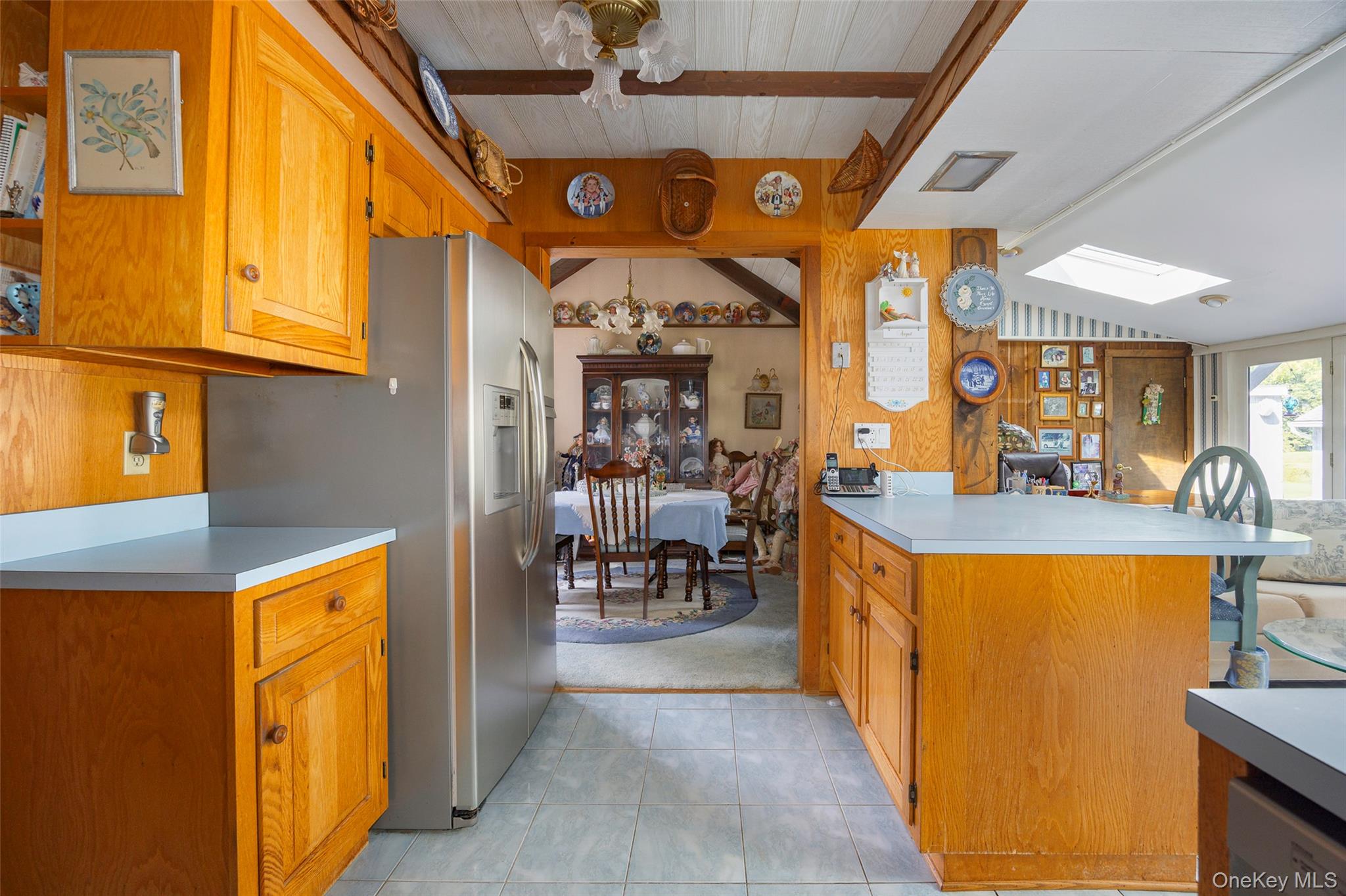 89 Deer Pond Road Verbank, NY 12585 - Photo 17 of 40 a view of a hallway with dining area and chandelier
