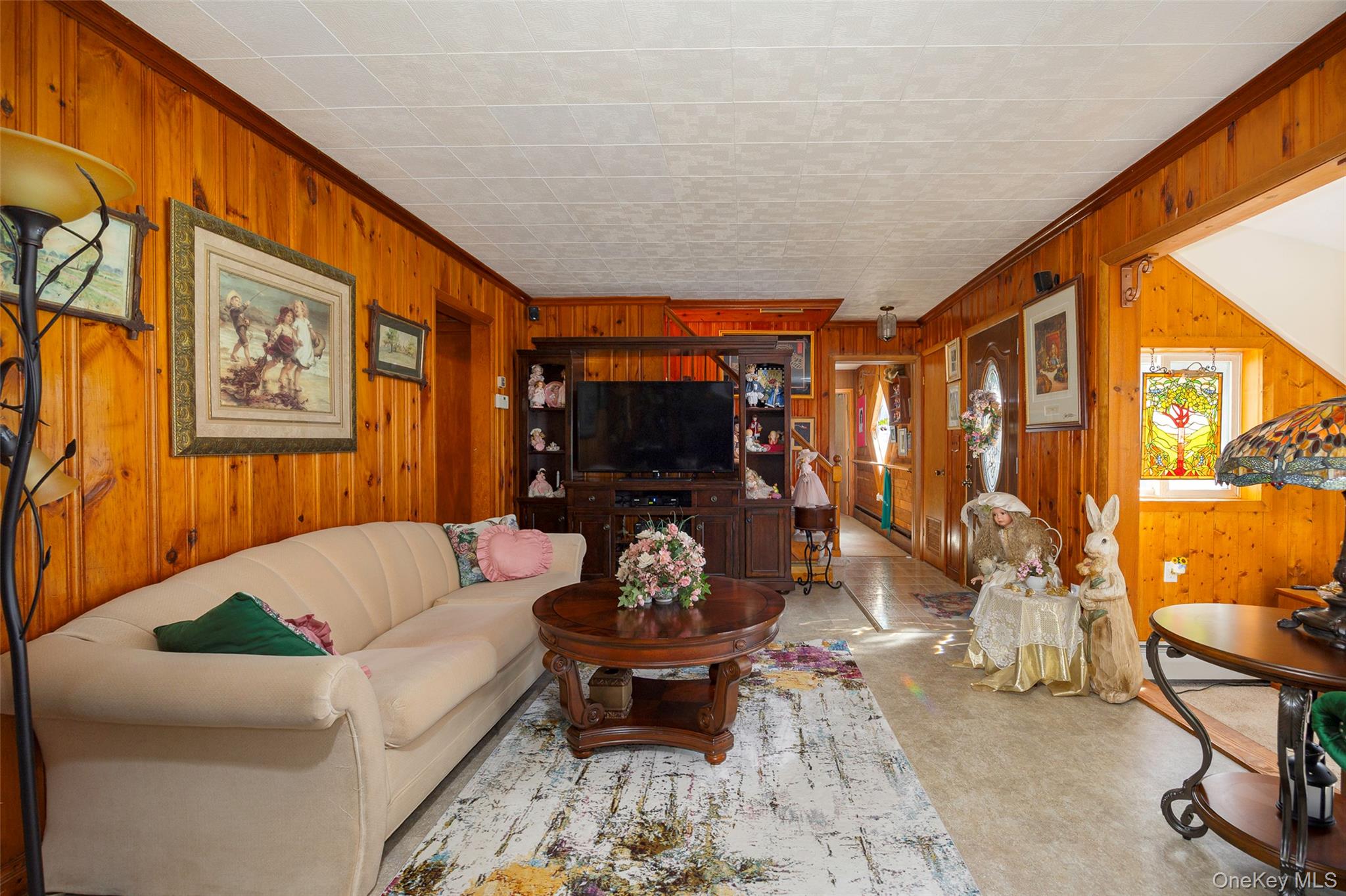 89 Deer Pond Road Verbank, NY 12585 - Photo 21 of 40 a living room with furniture a fireplace and a window