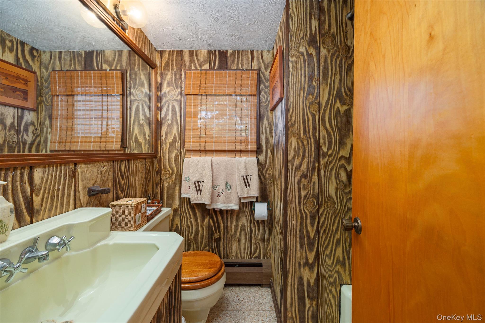 89 Deer Pond Road Verbank, NY 12585 - Photo 27 of 40 a bathroom with a sink a toilet and tub