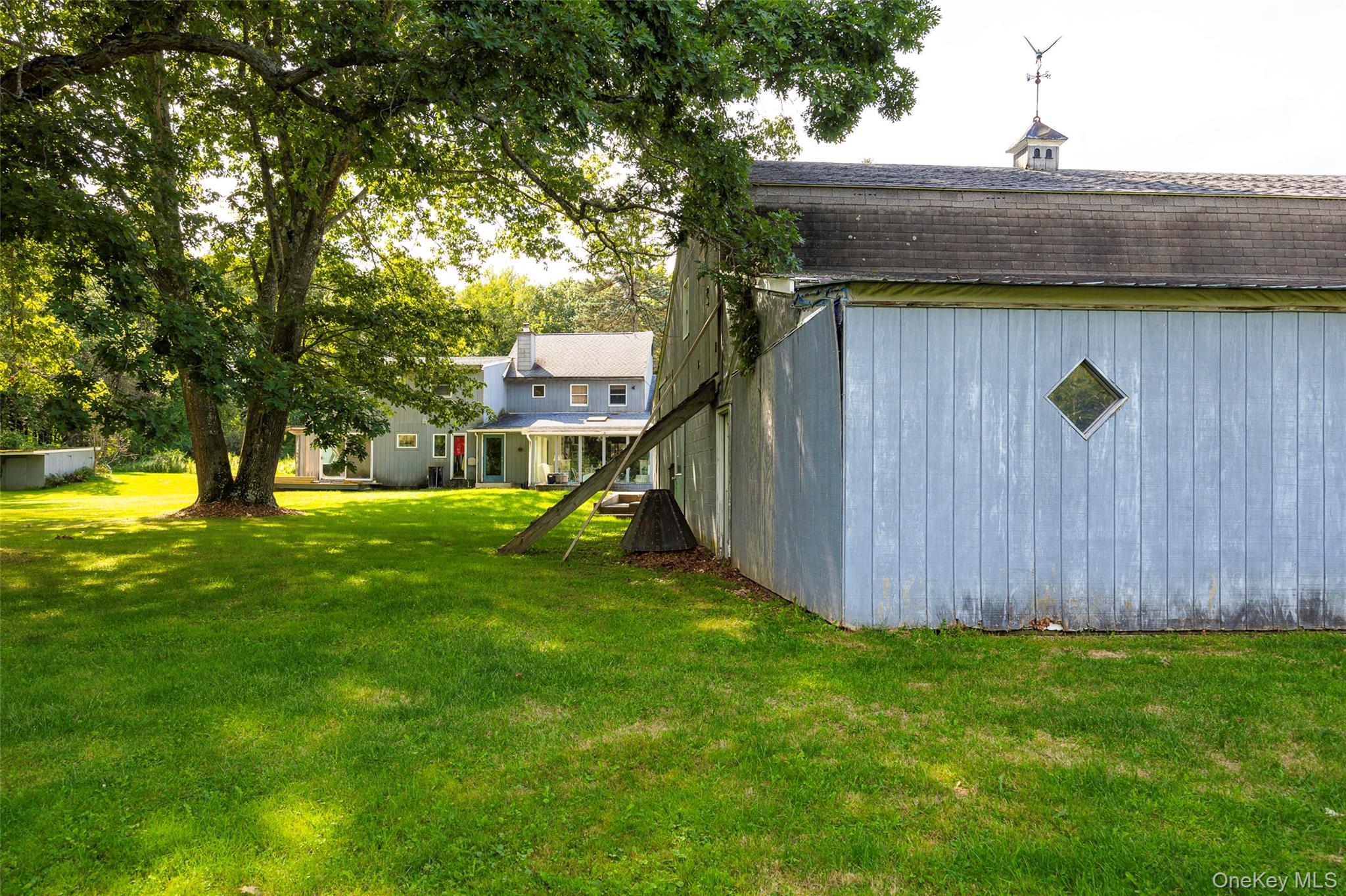 89 Deer Pond Road Verbank, NY 12585 - Photo 33 of 40 a view of a backyard with a tree