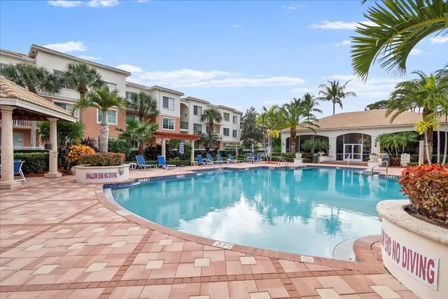 a view of a brick building next to a yard