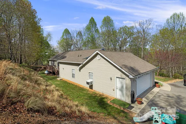 a aerial view of a house with a yard