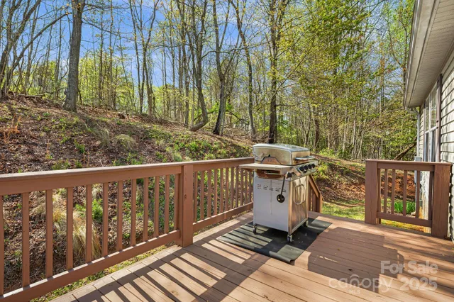 a view of a balcony with wooden floor