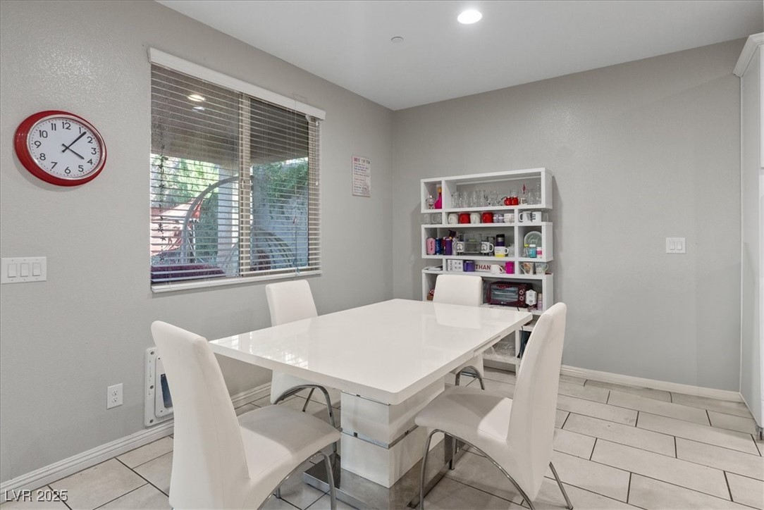 936 Keesey Way Henderson, NV 89052 - Photo 13 of 30 Dining area featuring light tile patterned flooring and recessed lighting