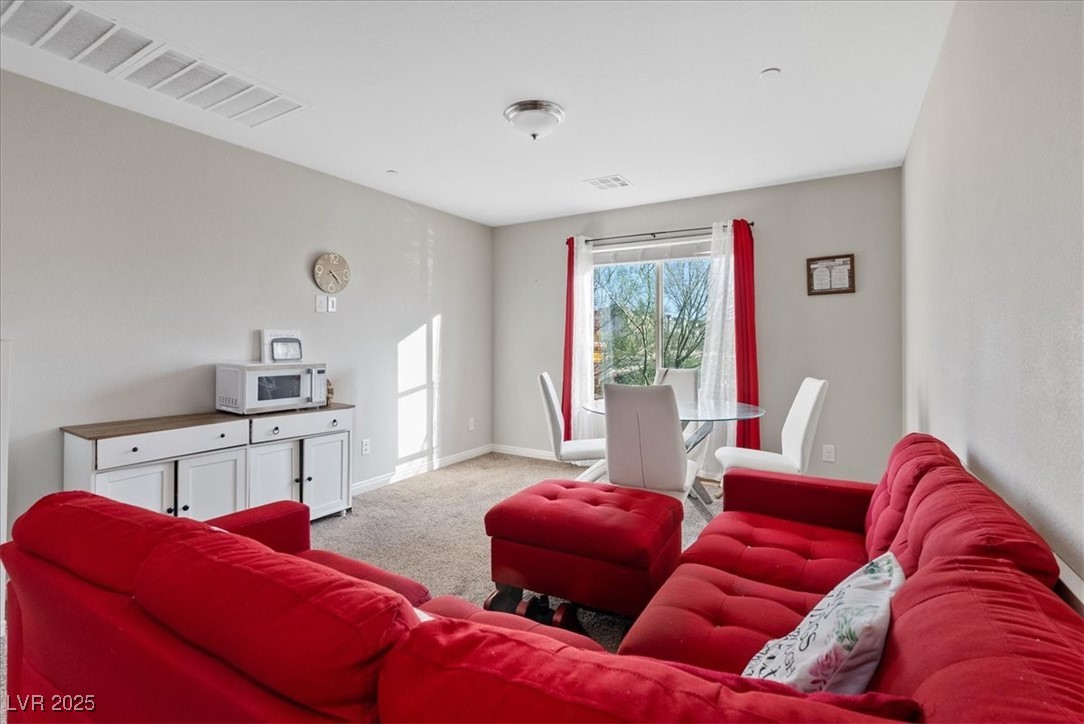 936 Keesey Way Henderson, NV 89052 - Photo 20 of 30 Living area with light colored carpet and baseboards