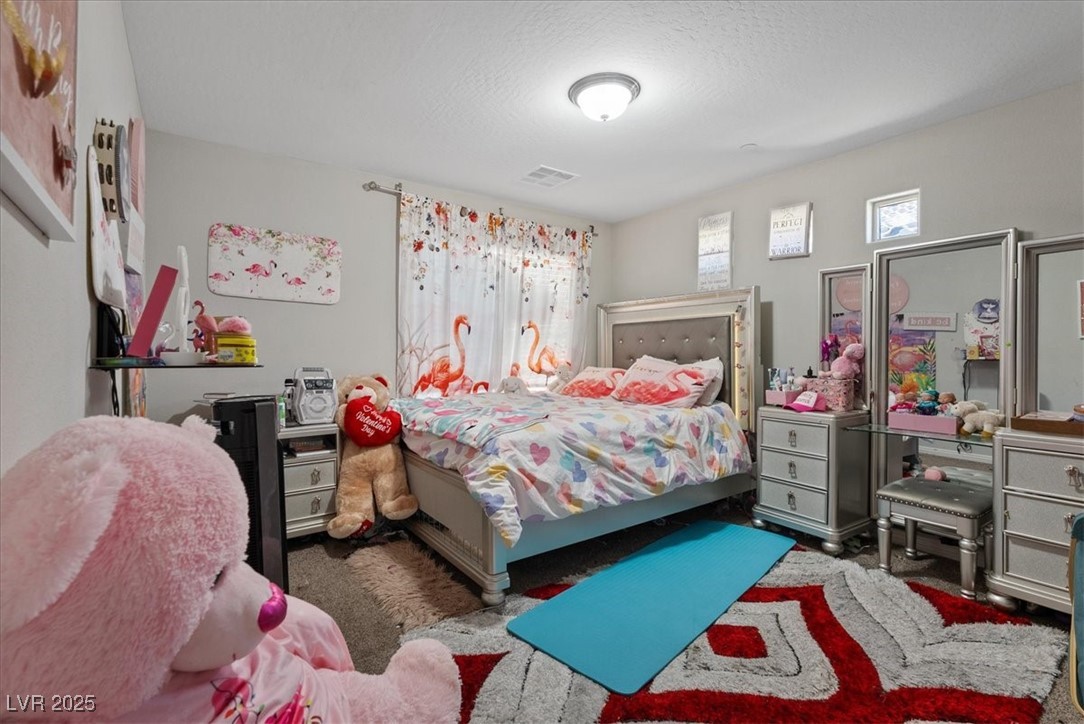 936 Keesey Way Henderson, NV 89052 - Photo 23 of 30 Bedroom featuring carpet flooring and a textured ceiling