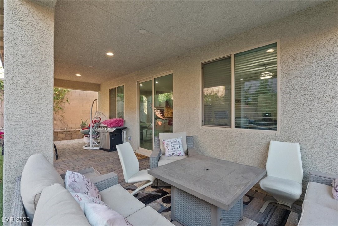 936 Keesey Way Henderson, NV 89052 - Photo 27 of 30 View of patio featuring an outdoor hangout area and outdoor dining space