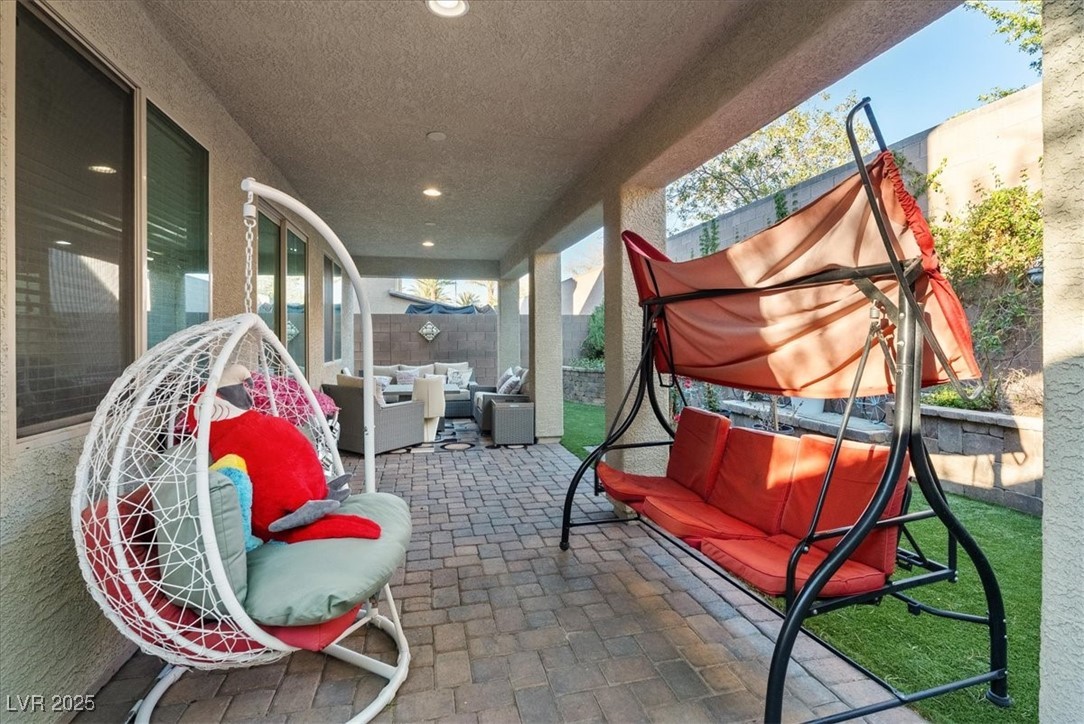 936 Keesey Way Henderson, NV 89052 - Photo 29 of 30 Fenced backyard featuring outdoor lounge area and a patio area