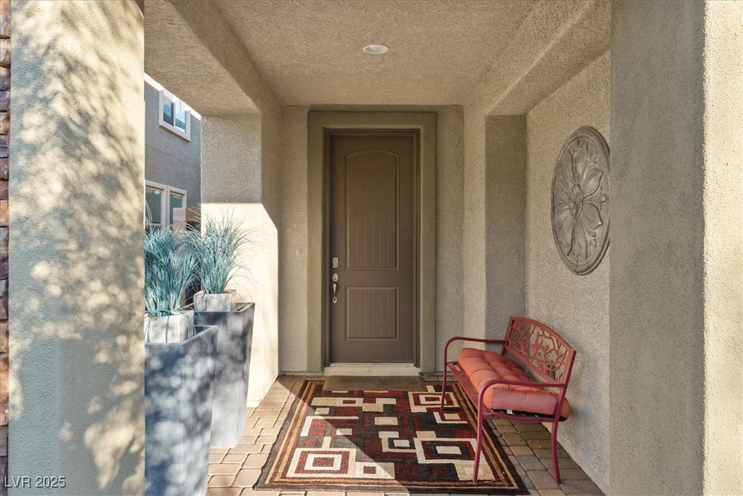 936 Keesey Way Henderson, NV 89052 - Photo 4 of 30 Doorway to property with stucco siding