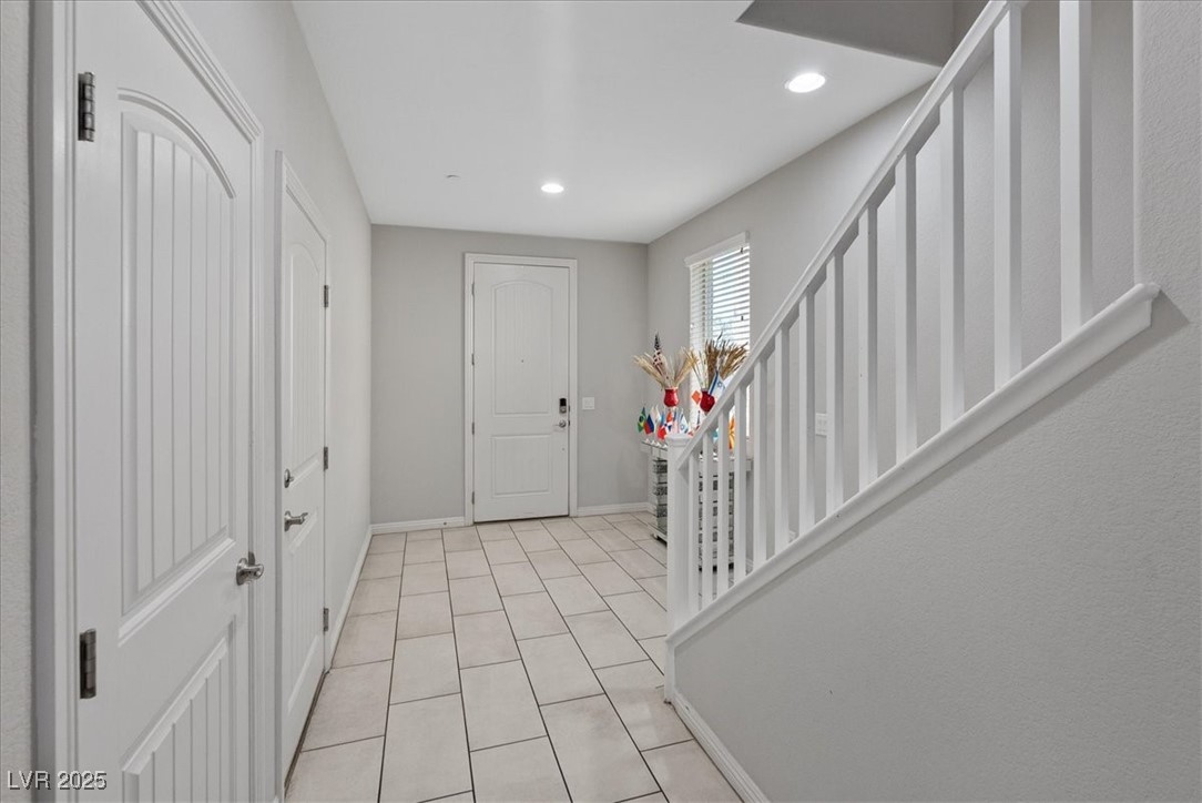 936 Keesey Way Henderson, NV 89052 - Photo 5 of 30 Entryway featuring stairs, light tile patterned floors, and recessed lighting