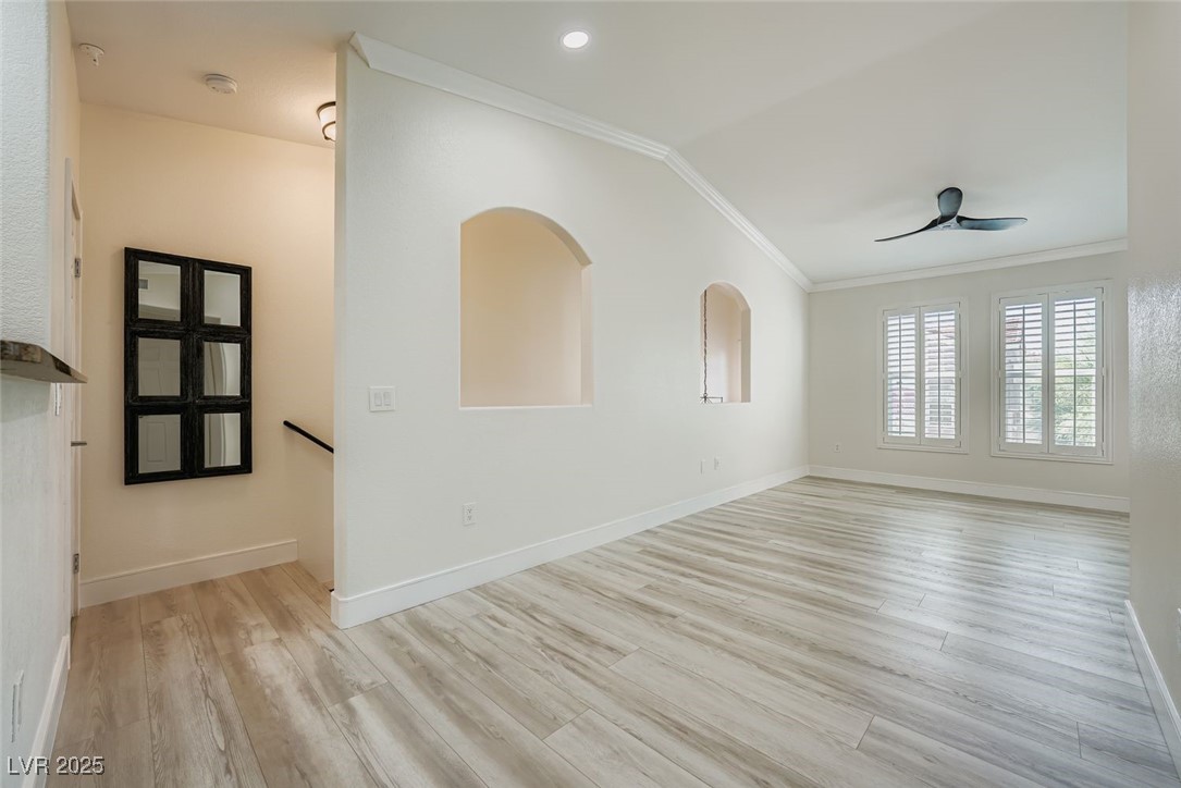 10550 West Alexander Road, Unit 2219 Las Vegas, NV 89129 - Photo 15 of 29 Spare room with light wood-style flooring, ornamental molding, ceiling fan, and lofted ceiling