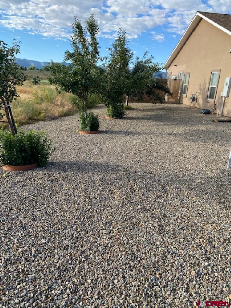 1941 Kaleigh Circle Cortez, CO 81321 - Photo 13 of 35 a view of a yard with wooden fence
