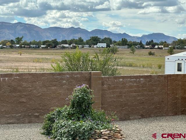 1941 Kaleigh Circle Cortez, CO 81321 - Photo 17 of 35 a view of a lake with a mountain in the background
