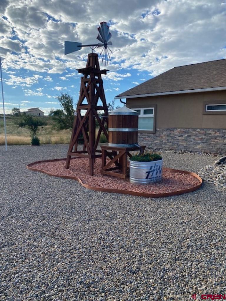 1941 Kaleigh Circle Cortez, CO 81321 - Photo 2 of 35 a view of a backyard with a trampoline