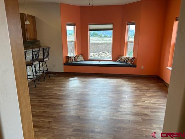 1941 Kaleigh Circle Cortez, CO 81321 - Photo 24 of 35 a view of room with window and wooden floor