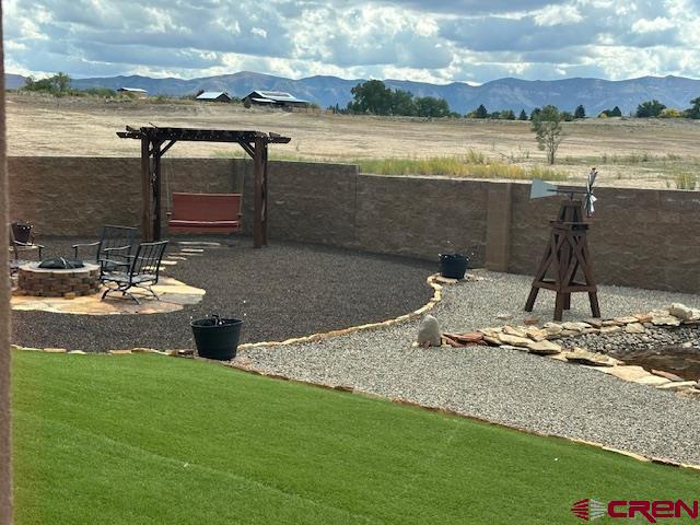 1941 Kaleigh Circle Cortez, CO 81321 - Photo 3 of 35 a view of a lake with a house in the background