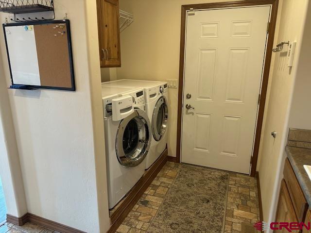 1941 Kaleigh Circle Cortez, CO 81321 - Photo 31 of 35 a utility room with dryer and washer